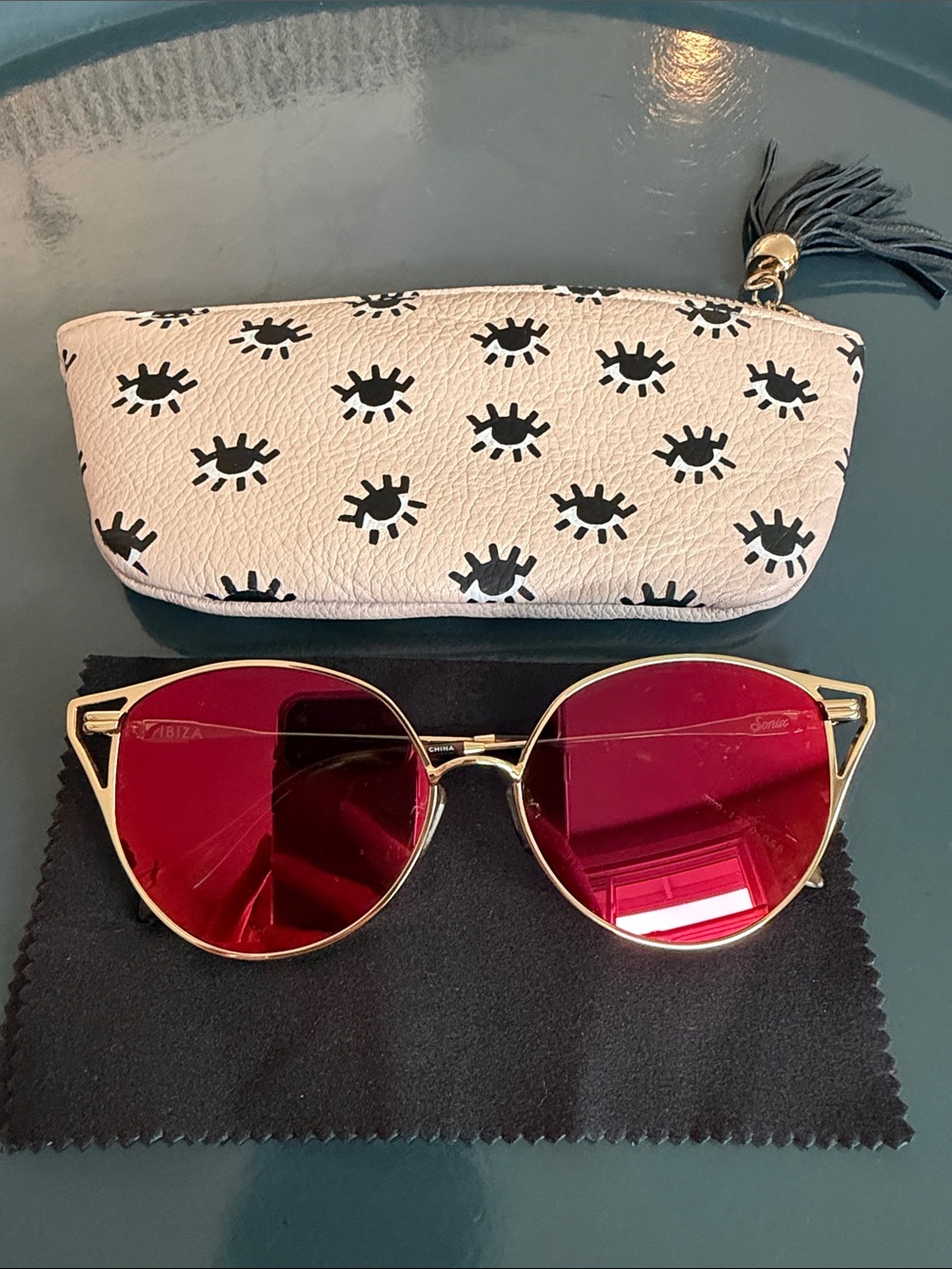 Sonix Gold Frame Sunglasses with mirrored Lenses and Eye Print Case